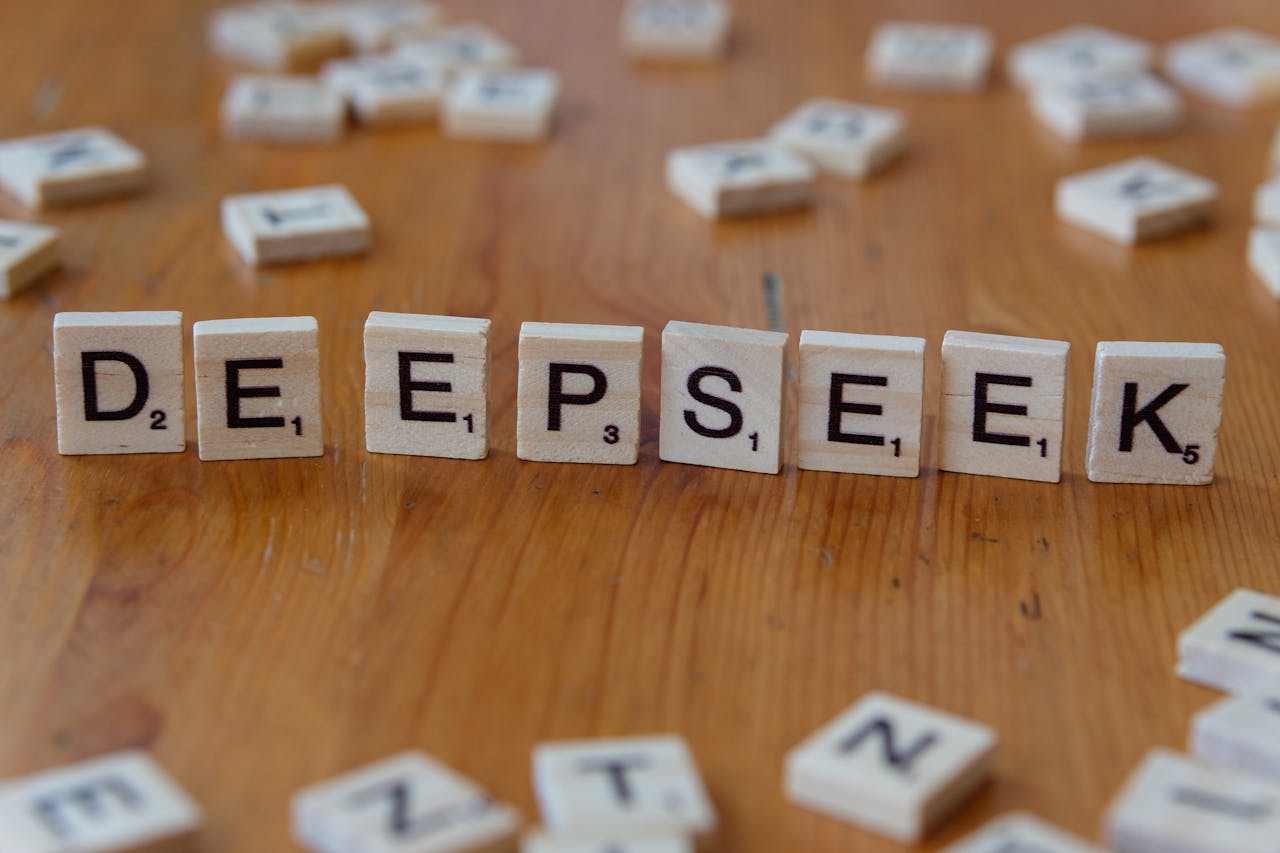 why-choose-us Scrabble tiles spelling 'DeepSeek' on a wooden surface. Perfect for AI and tech themes.